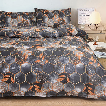 Geometrischer Bettbezug und Kopfkissenbezug mit Blattgold