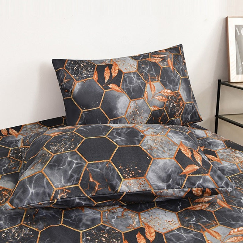 Geometrischer Bettbezug und Kopfkissenbezug mit Blattgold
